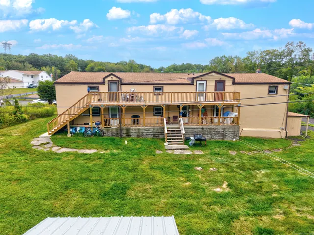a aerial view of a house with a big yard