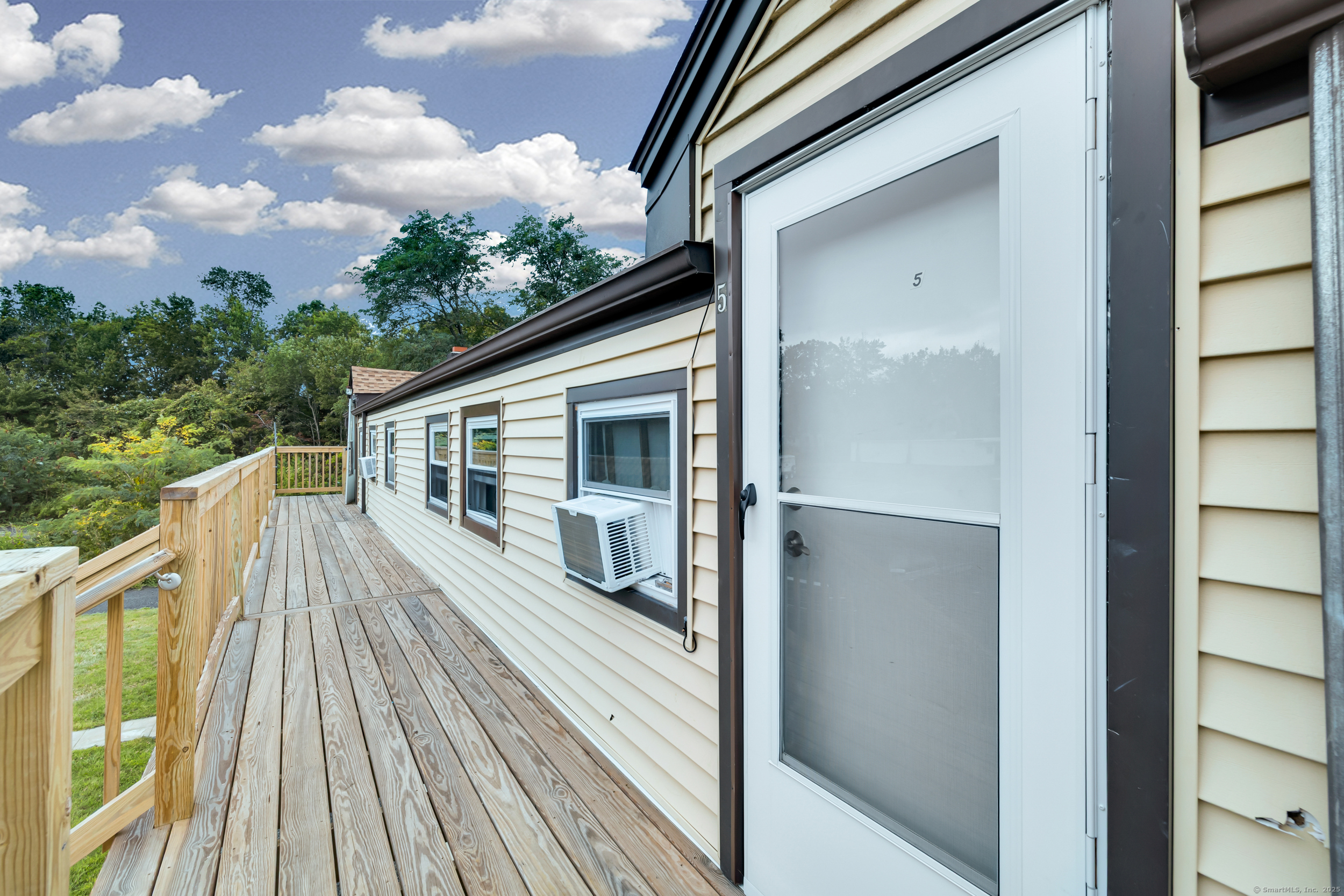 1259 Wolcott Road Wolcott, CT 06716 - Photo 6 of 30 a view of balcony with wooden floor and fence