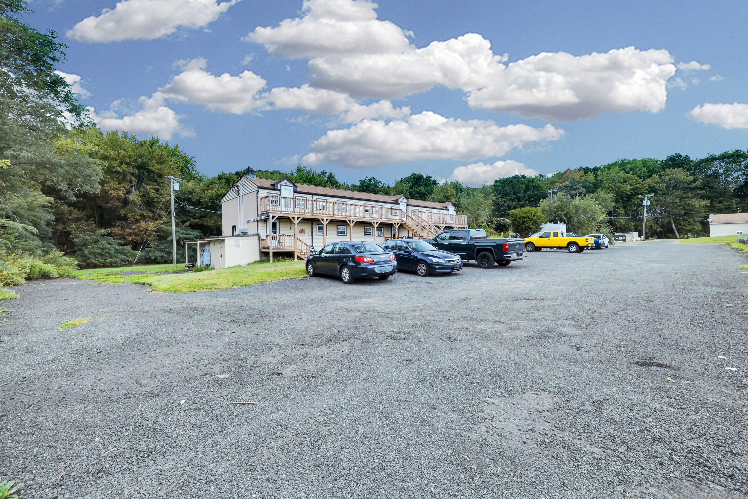 1259 Wolcott Road Wolcott, CT 06716 - Photo 8 of 30 a car parked in front of a house