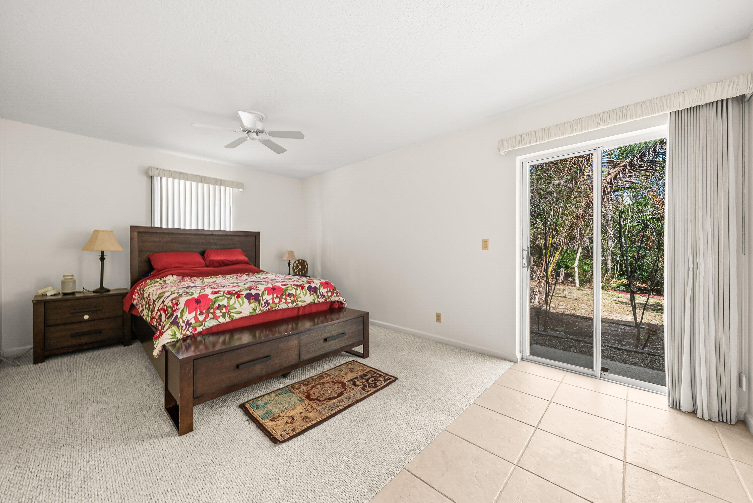 18098 93rd Road North The Acreage, FL 33470 - Photo 22 of 60 a bedroom with a bed and a window
