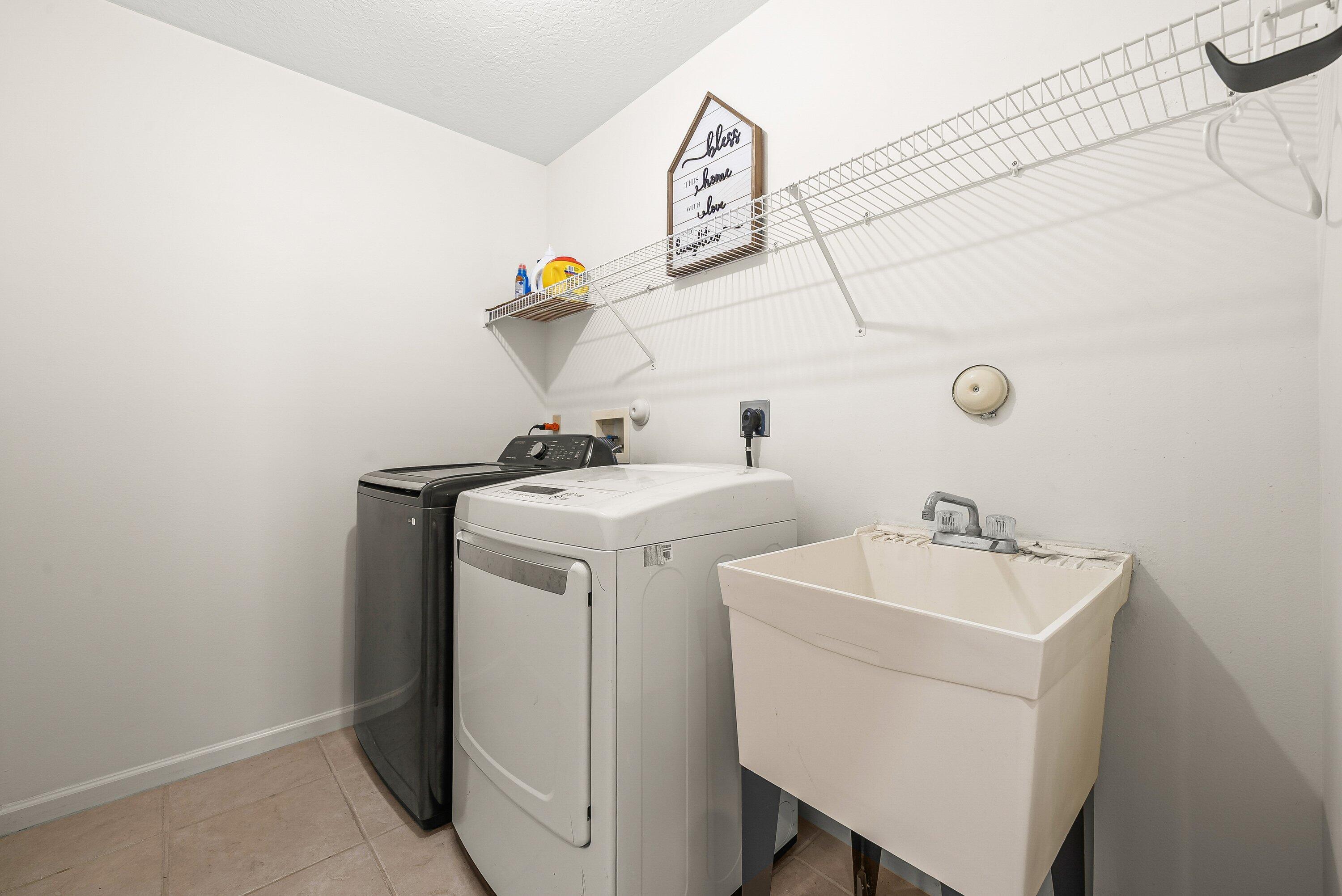 18098 93rd Road North The Acreage, FL 33470 - Photo 27 of 60 a utility room with dryer and washer