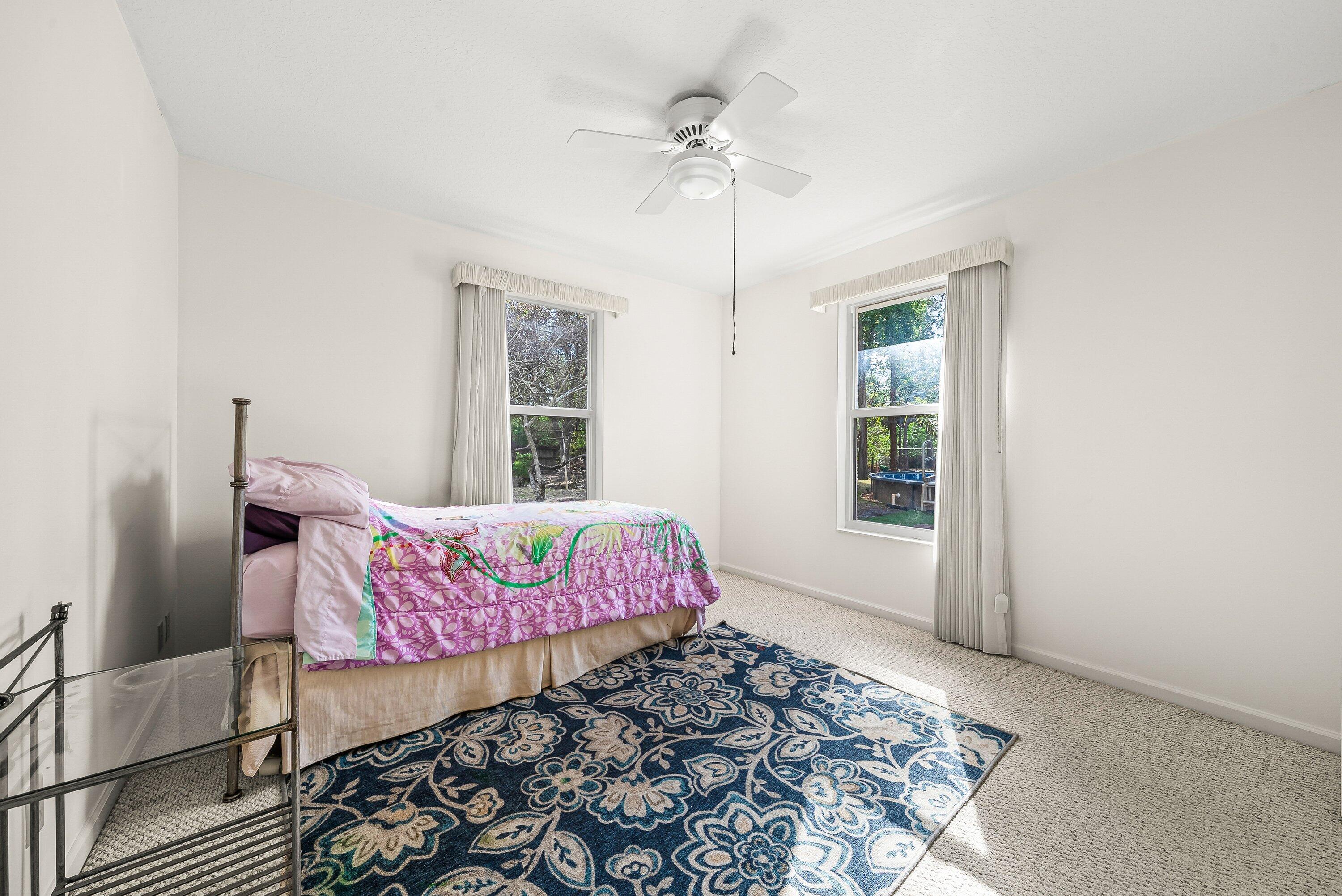 18098 93rd Road North The Acreage, FL 33470 - Photo 28 of 60 a bedroom with a bed and a window