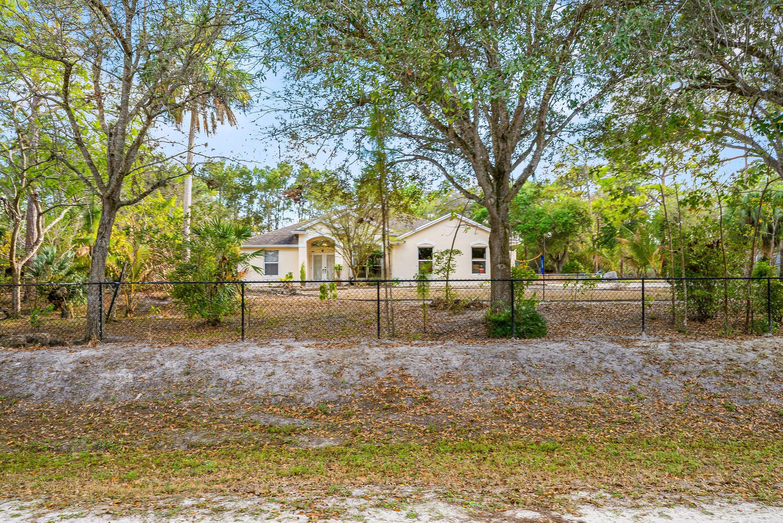 18098 93rd Road North The Acreage, FL 33470 - Photo 3 of 60 a view of backyard of the house