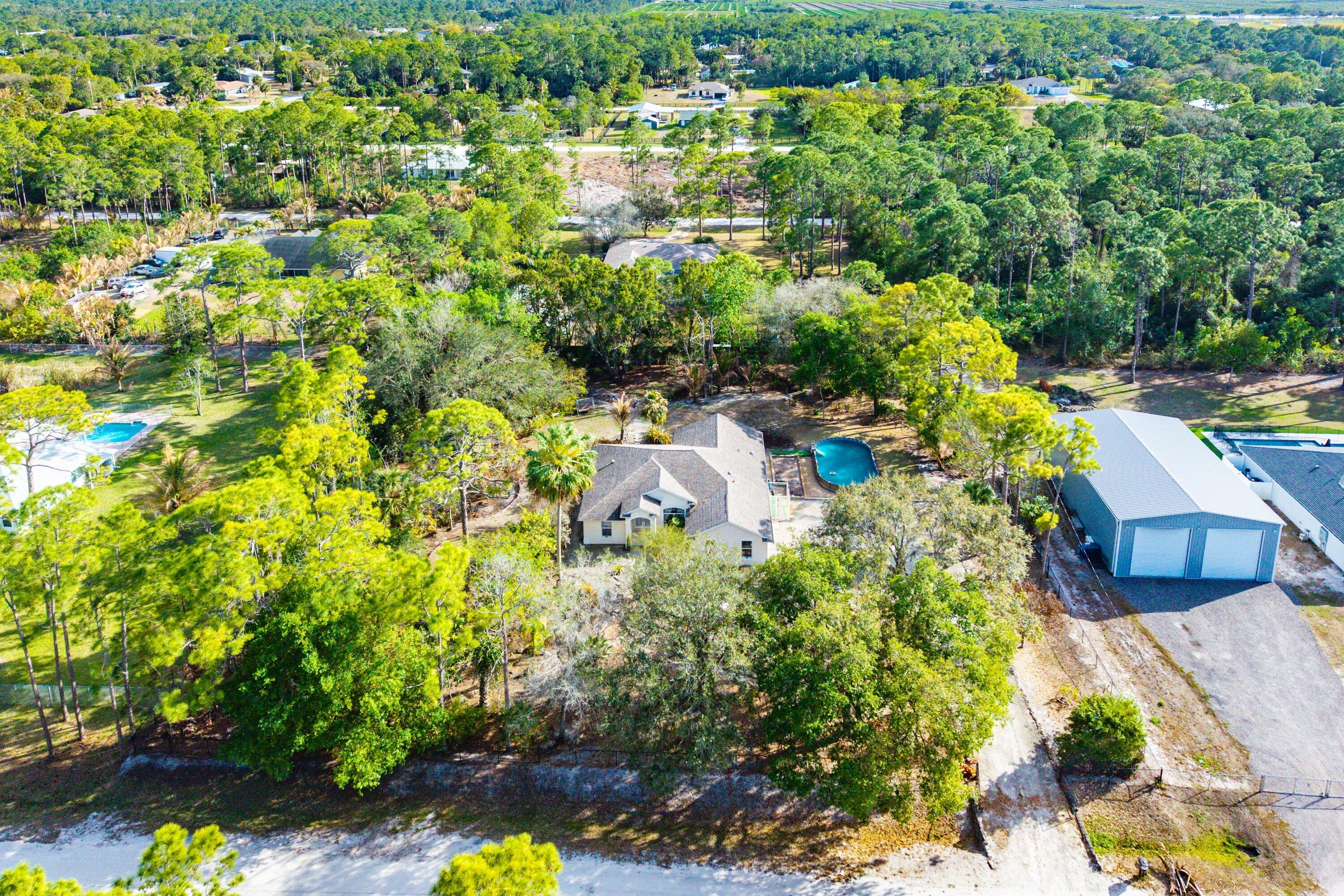 18098 93rd Road North The Acreage, FL 33470 - Photo 53 of 60 a view of a garden with plants
