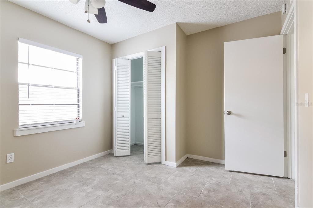 3211 Timberline Road Winter Haven, FL 33880 - Photo 12 of 15 a view of an empty room with a window