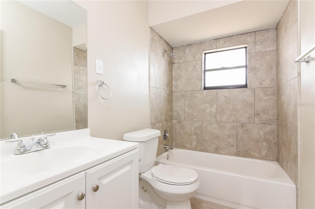 3211 Timberline Road Winter Haven, FL 33880 - Photo 14 of 15 a bathroom with a sink toilet and shower