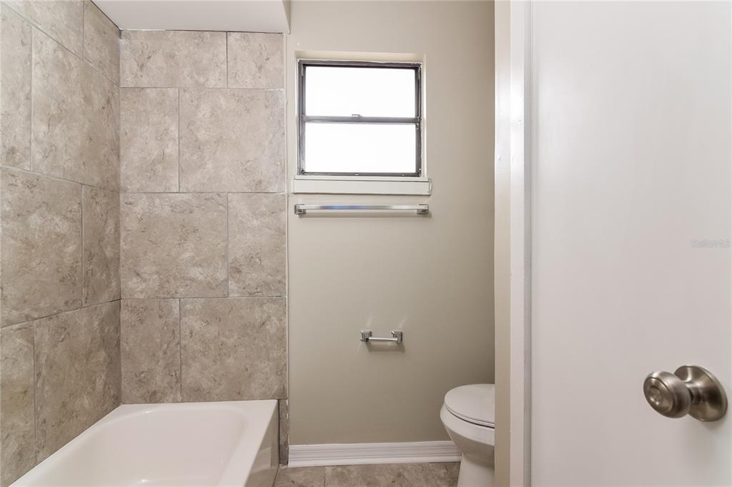 3211 Timberline Road Winter Haven, FL 33880 - Photo 8 of 15 a bathroom with a toilet and a shower