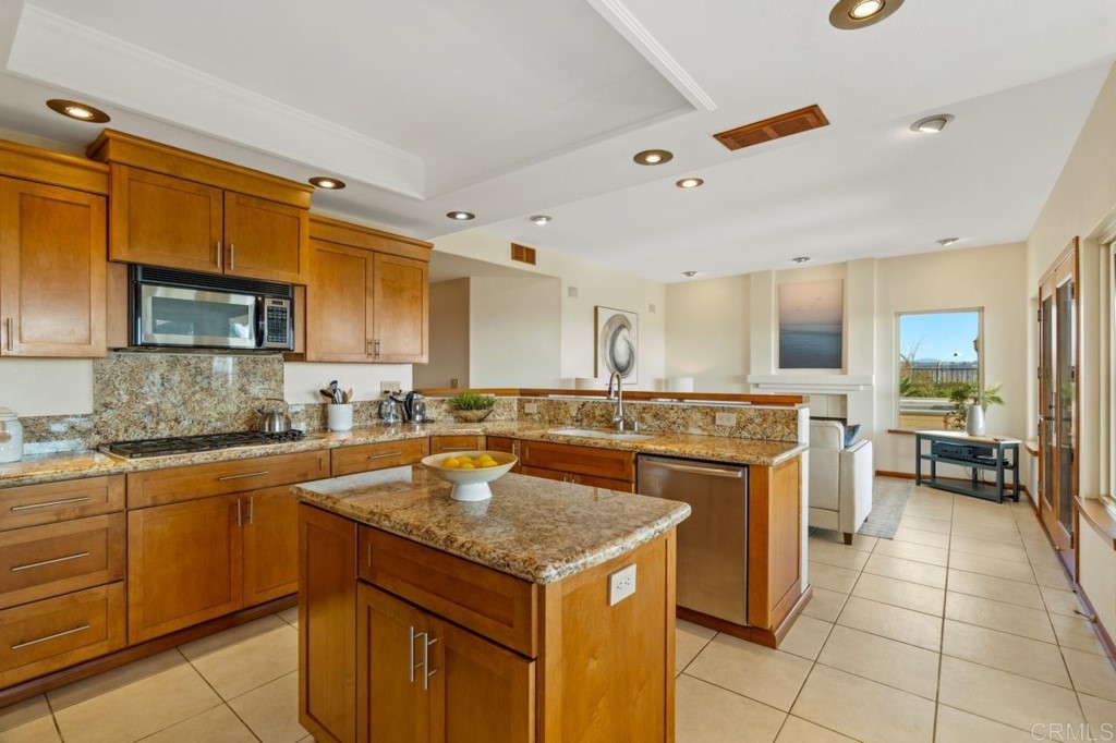 4565 Sea Bluff Circle Carlsbad, CA 92008 - Photo 17 of 62 a kitchen with a stove sink and cabinets