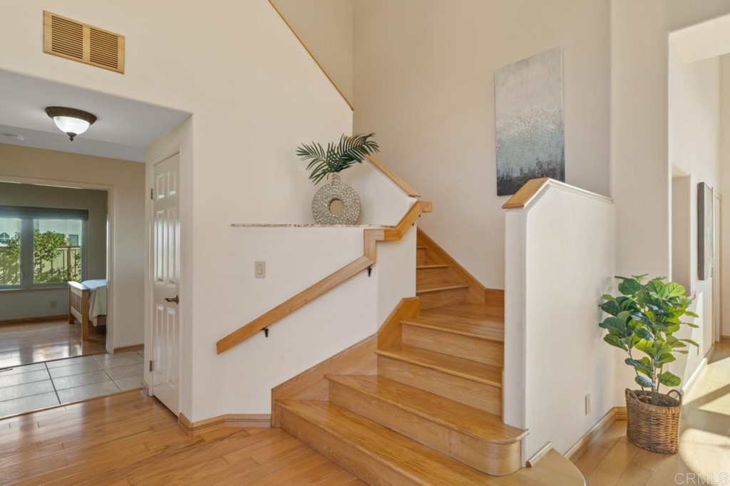 4565 Sea Bluff Circle Carlsbad, CA 92008 - Photo 23 of 62 a view of entryway and hall with wooden floor