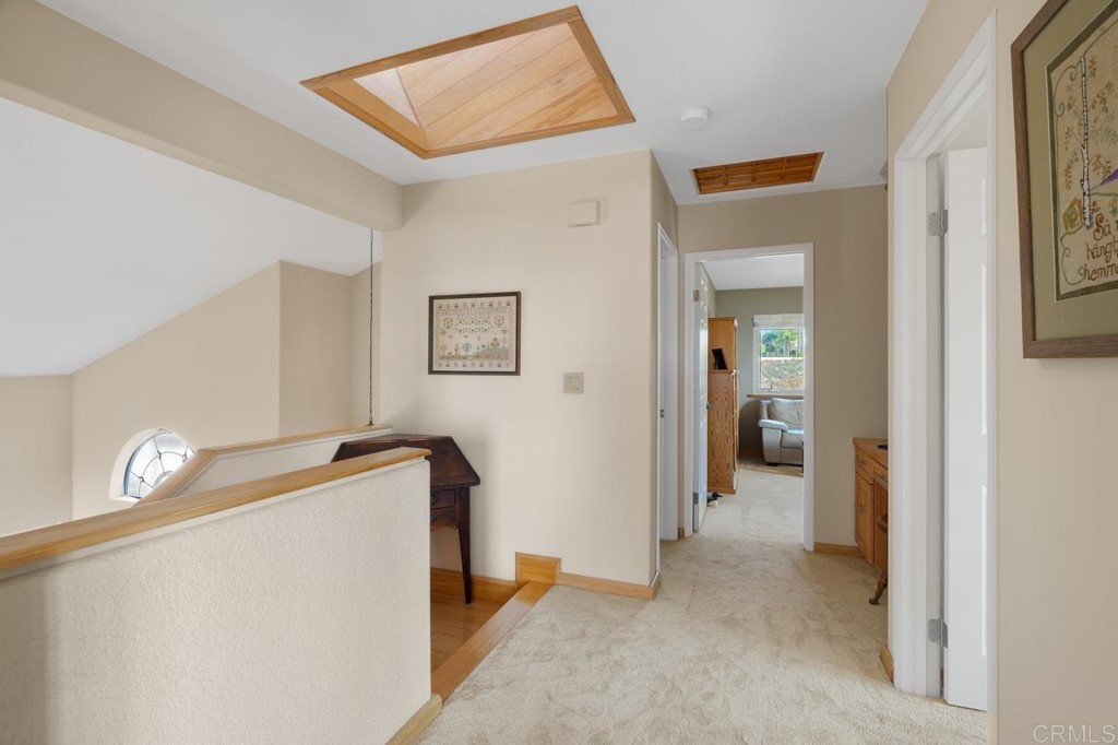 4565 Sea Bluff Circle Carlsbad, CA 92008 - Photo 24 of 62 a view of a hallway to a livingroom with furniture