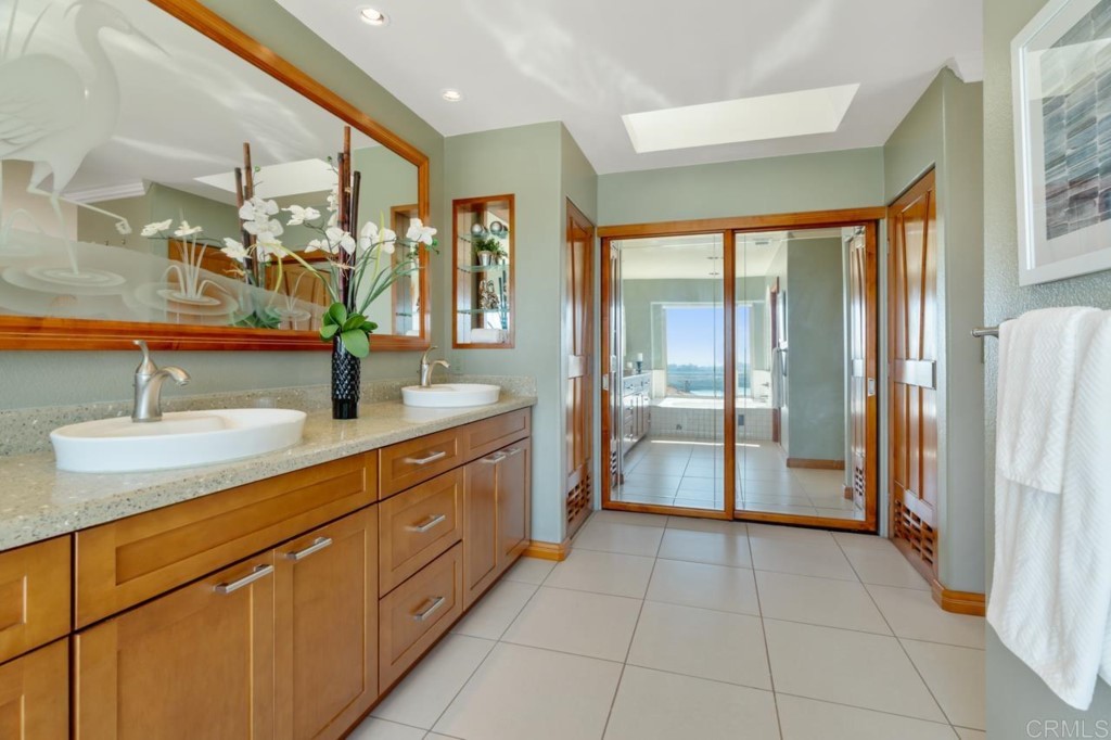 4565 Sea Bluff Circle Carlsbad, CA 92008 - Photo 35 of 62 a kitchen with stainless steel appliances granite countertop a sink and a refrigerator
