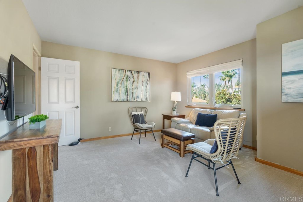 4565 Sea Bluff Circle Carlsbad, CA 92008 - Photo 41 of 62 a living room with furniture and a window