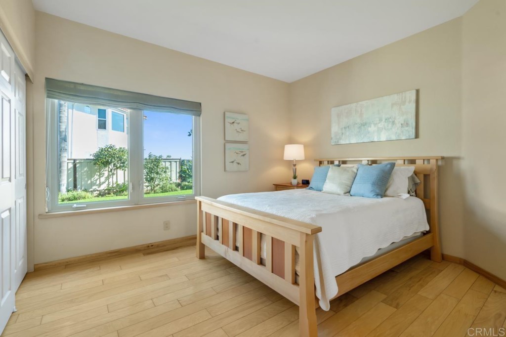 4565 Sea Bluff Circle Carlsbad, CA 92008 - Photo 43 of 62 a bed sitting in a bedroom next to a window