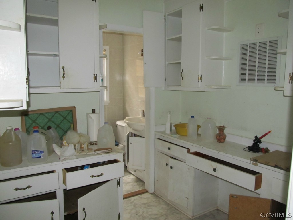 9011 Beach Road Chesterfield, VA 23838 - Photo 16 of 16 a view of cabinets and wooden floor