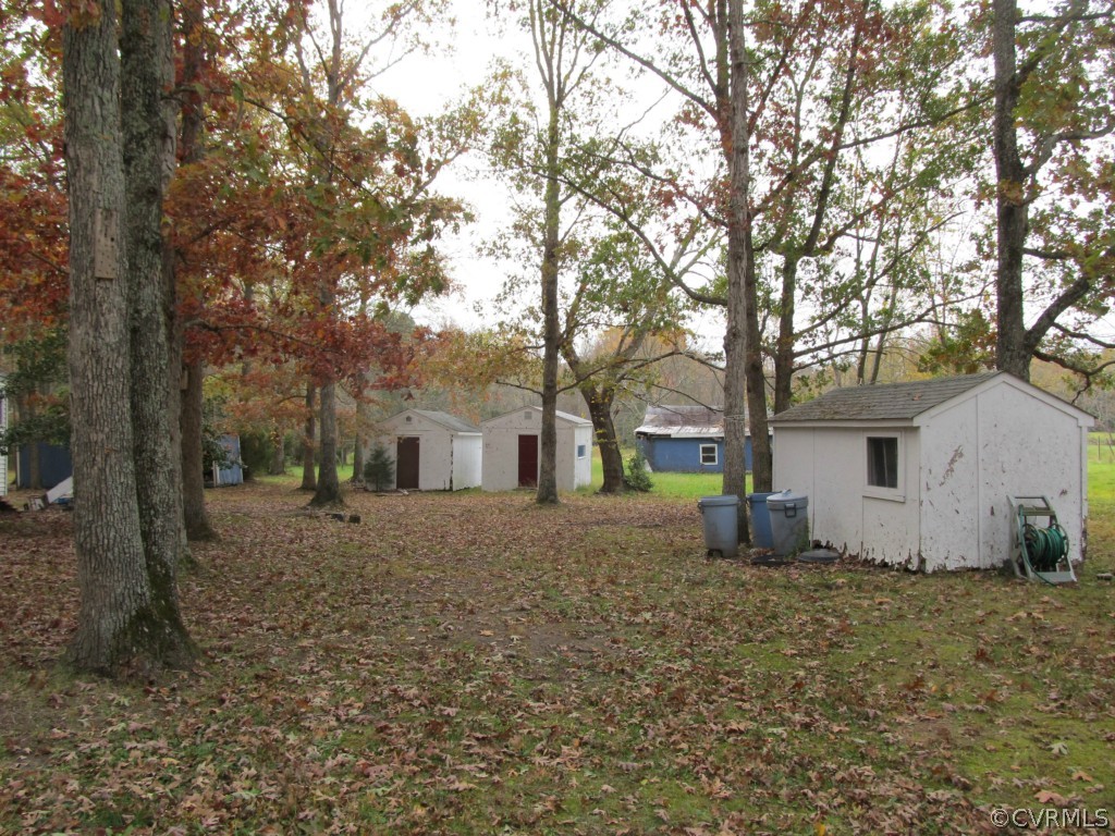 9011 Beach Road Chesterfield, VA 23838 - Photo 3 of 16 a house that has a tree in front of it