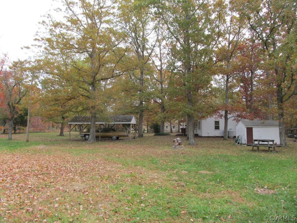 9011 Beach Road Chesterfield, VA 23838 - Photo 4 of 16 a view of a house with a yard and sitting area
