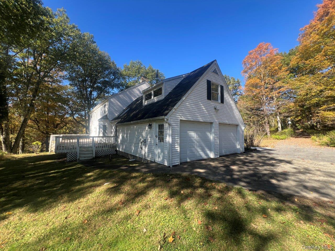 7 Felter Hill Road Monroe, NY 10950 - Photo 6 of 12 View of home's exterior with a deck, a yard, and driveway