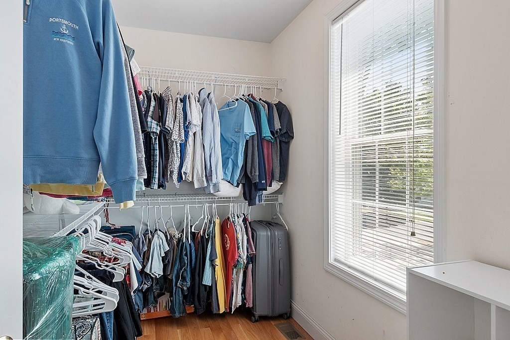 63 Manchester Street Nashua, NH 03064 - Photo 24 of 39 a view of walk in closet with clothes and shoes