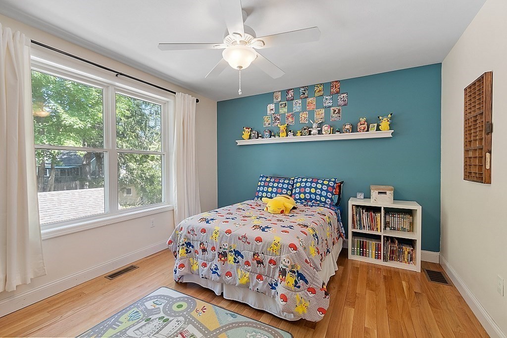 63 Manchester Street Nashua, NH 03064 - Photo 28 of 39 a bedroom with a bed and a window