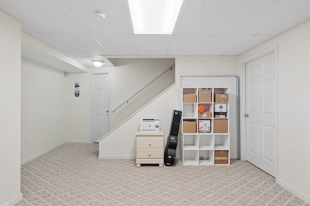 63 Manchester Street Nashua, NH 03064 - Photo 32 of 39 a view of an empty room with stairs