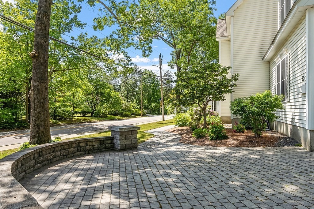 63 Manchester Street Nashua, NH 03064 - Photo 4 of 39 a view of a swimming pool with a patio