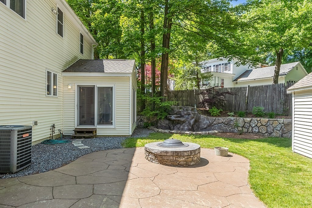 63 Manchester Street Nashua, NH 03064 - Photo 5 of 39 a view of a house with backyard and sitting area