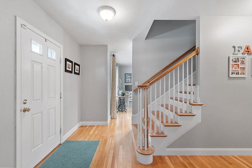 63 Manchester Street Nashua, NH 03064 - Photo 8 of 39 a view of entryway with wooden floor