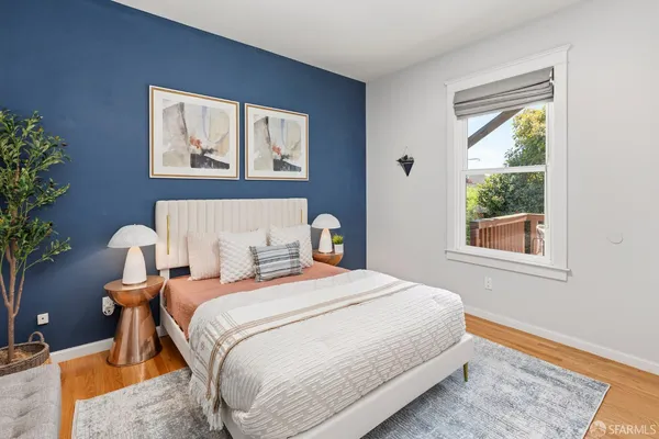 a bedroom with a bed and a couch
