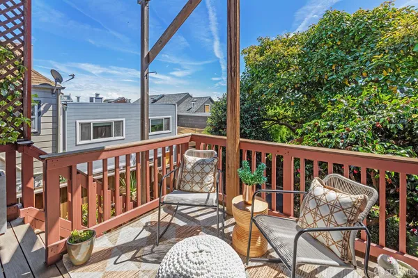 a view of balcony with furniture