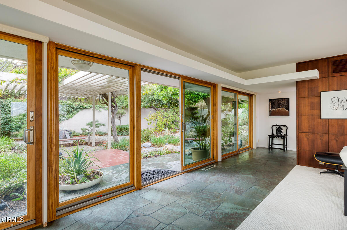775 Panorama Place Pasadena, CA 91105 - Photo 12 of 62 a view of a room with a large window and a porch