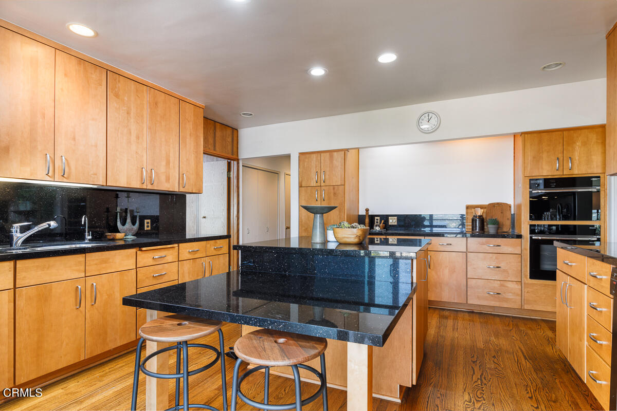 775 Panorama Place Pasadena, CA 91105 - Photo 16 of 62 a kitchen with stainless steel appliances granite countertop a stove a sink and a microwave