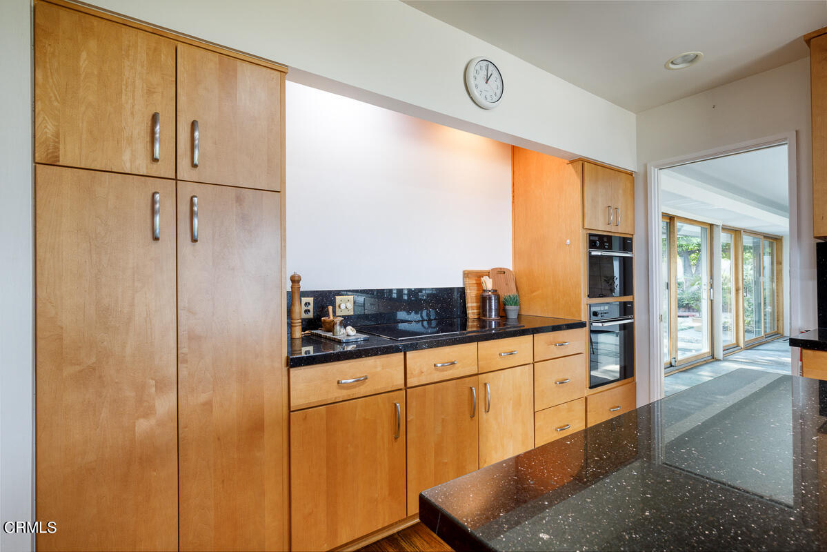 775 Panorama Place Pasadena, CA 91105 - Photo 19 of 62 a kitchen with stainless steel appliances granite countertop a refrigerator and a sink