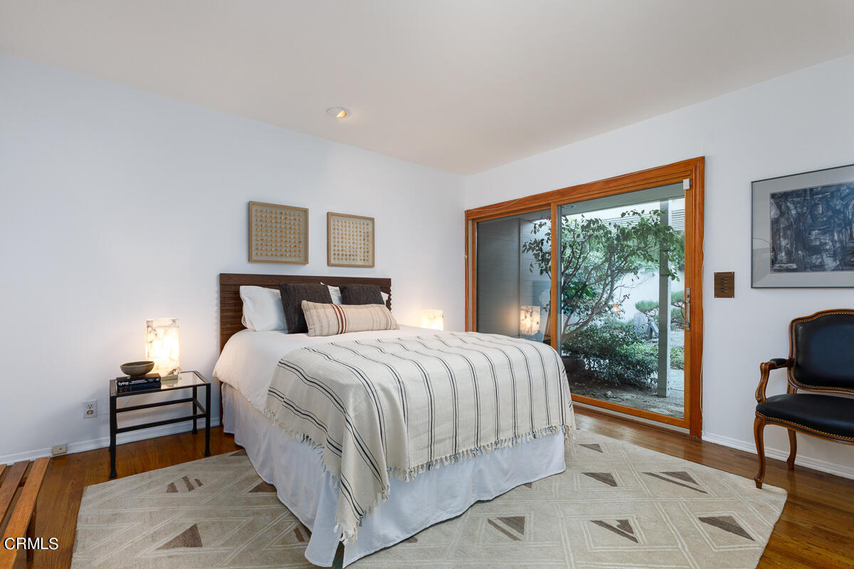 775 Panorama Place Pasadena, CA 91105 - Photo 27 of 62 a bedroom with a bed and wooden floor
