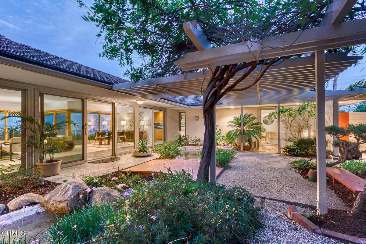 775 Panorama Place Pasadena, CA 91105 - Photo 3 of 62 a view of a patio with table and chairs potted plants and floor to ceiling window and potted plants