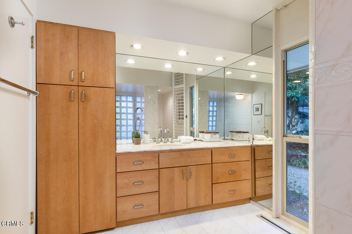 775 Panorama Place Pasadena, CA 91105 - Photo 35 of 62 a bathroom with a double vanity sink toilet and mirror