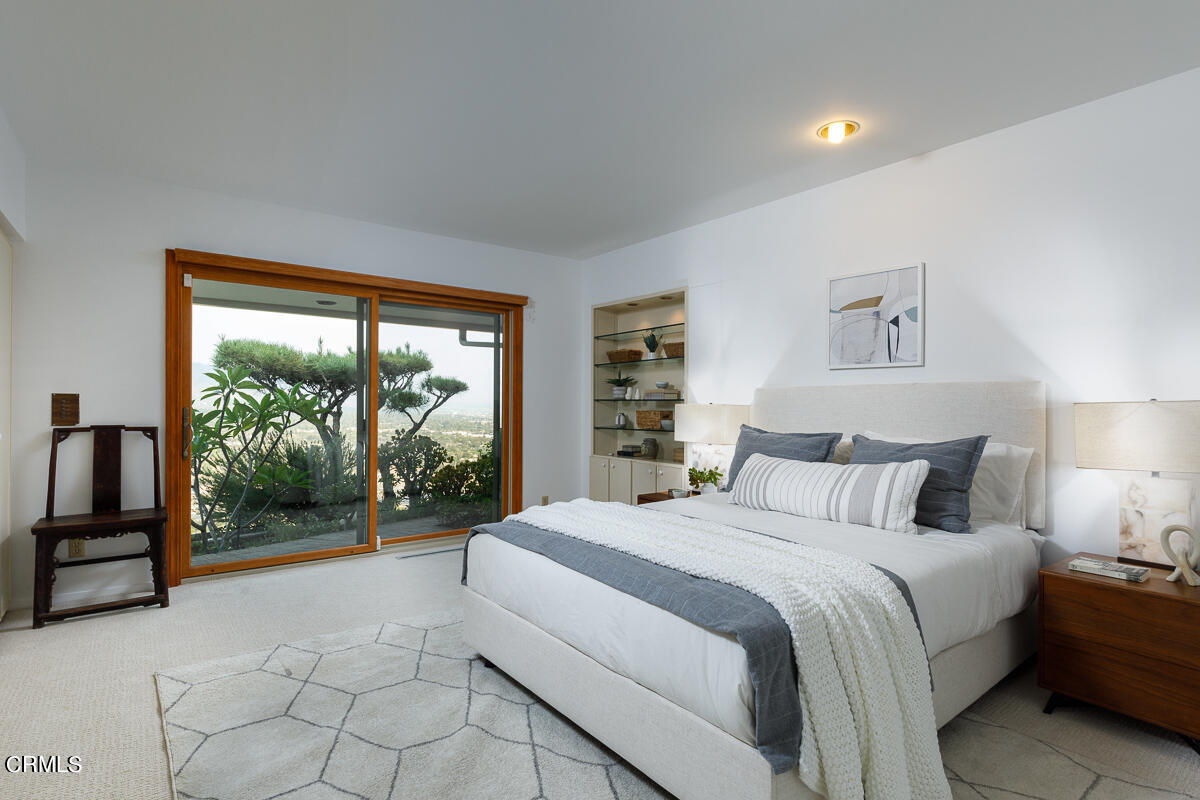 775 Panorama Place Pasadena, CA 91105 - Photo 38 of 62 a bedroom with a large bed and a large window