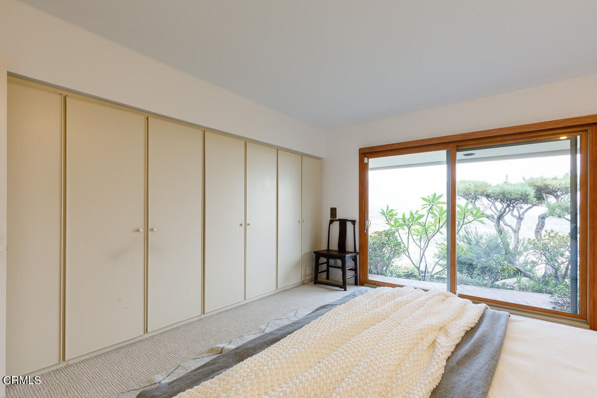 775 Panorama Place Pasadena, CA 91105 - Photo 39 of 62 a bedroom with a large window and a bed