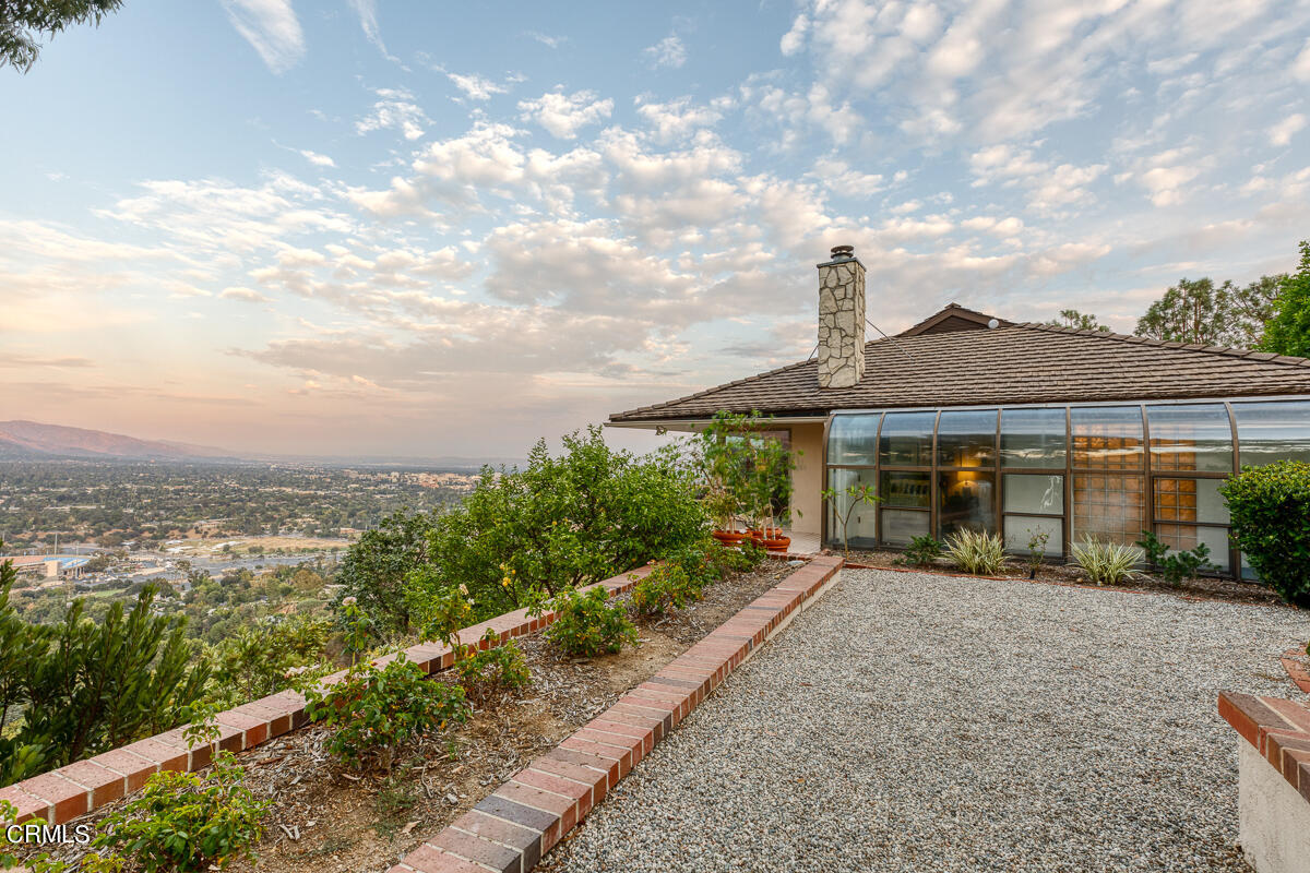 775 Panorama Place Pasadena, CA 91105 - Photo 52 of 62 a front view of a house with a yard and potted plants