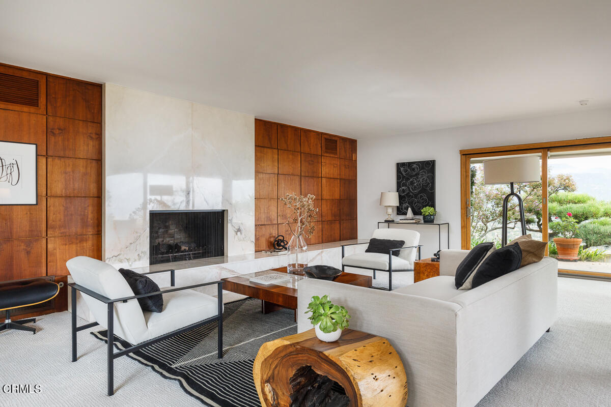 775 Panorama Place Pasadena, CA 91105 - Photo 9 of 62 a living room with furniture a fireplace and a floor to ceiling window