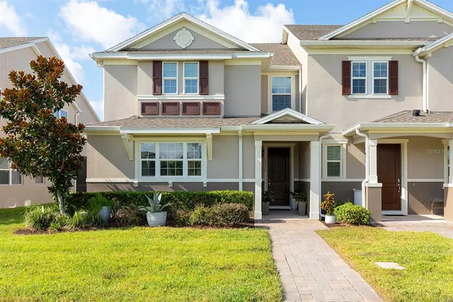 a front view of a house with a yard and porch