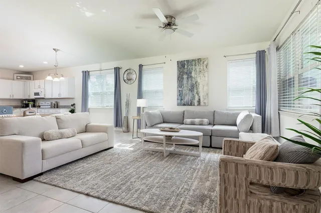 a bedroom with furniture and a window