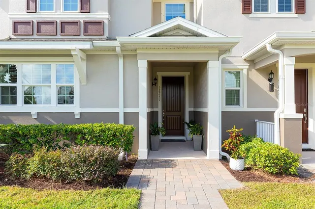 a view of a brick house with many windows