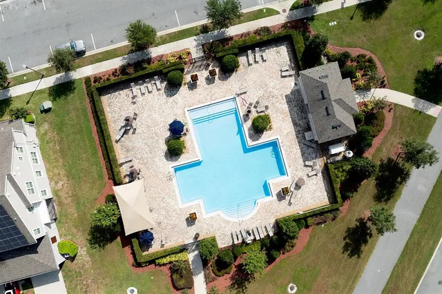 an aerial view of residential houses with outdoor space