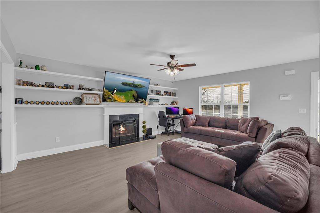 3455 Navigator Lane Gainesville, GA 30507 - Photo 4 of 19 a living room with furniture and a fireplace