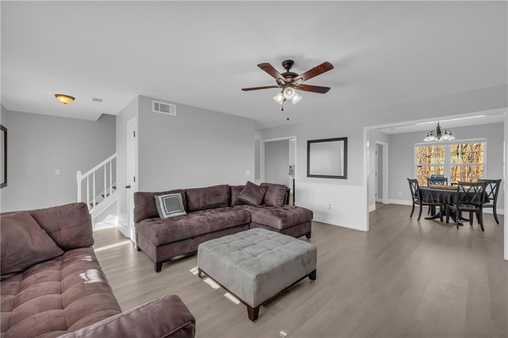 3455 Navigator Lane Gainesville, GA 30507 - Photo 5 of 19 a living room with furniture and a wooden floor
