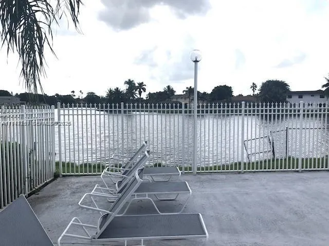a view of a wrought iron fences in front of house