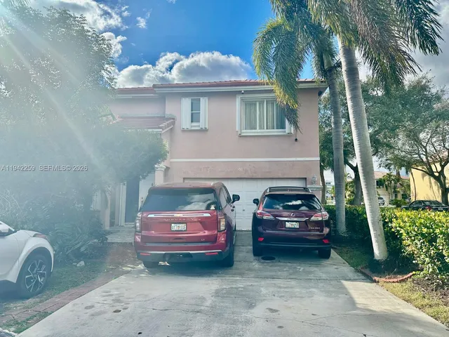 a car parked in front of a house