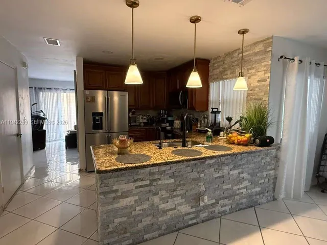 a view of a living room and kitchen view