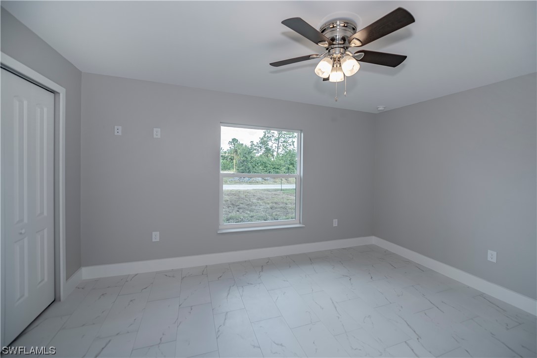 9035 West Crow Circle LaBelle, FL 33935 - Photo 17 of 32 a view of an empty room with a window