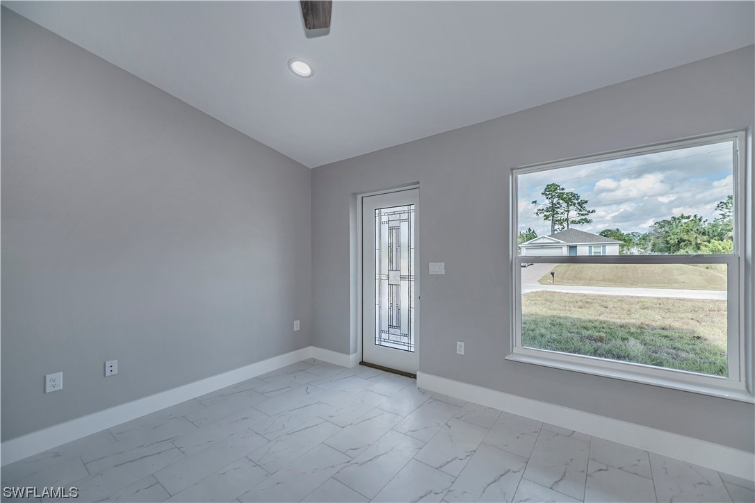 9035 West Crow Circle LaBelle, FL 33935 - Photo 3 of 32 en empty room with windows
